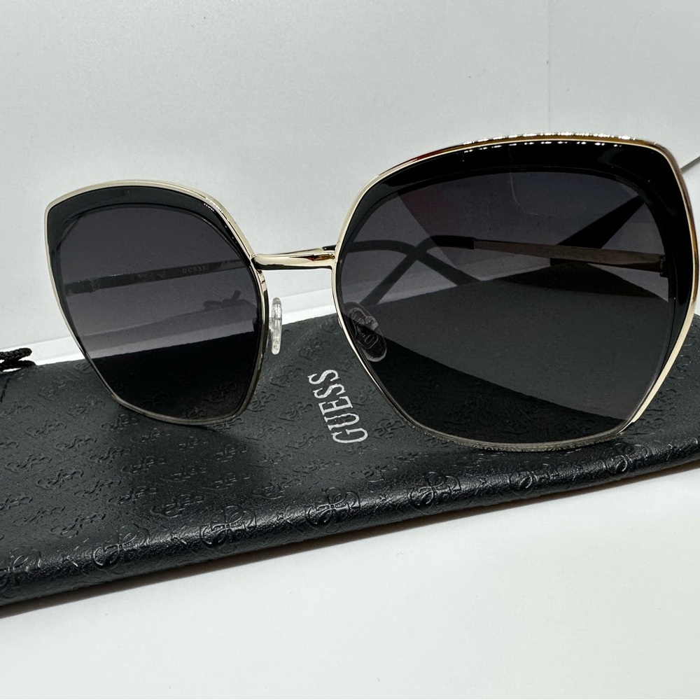 GUESS Sunglasses in Black and Gold.